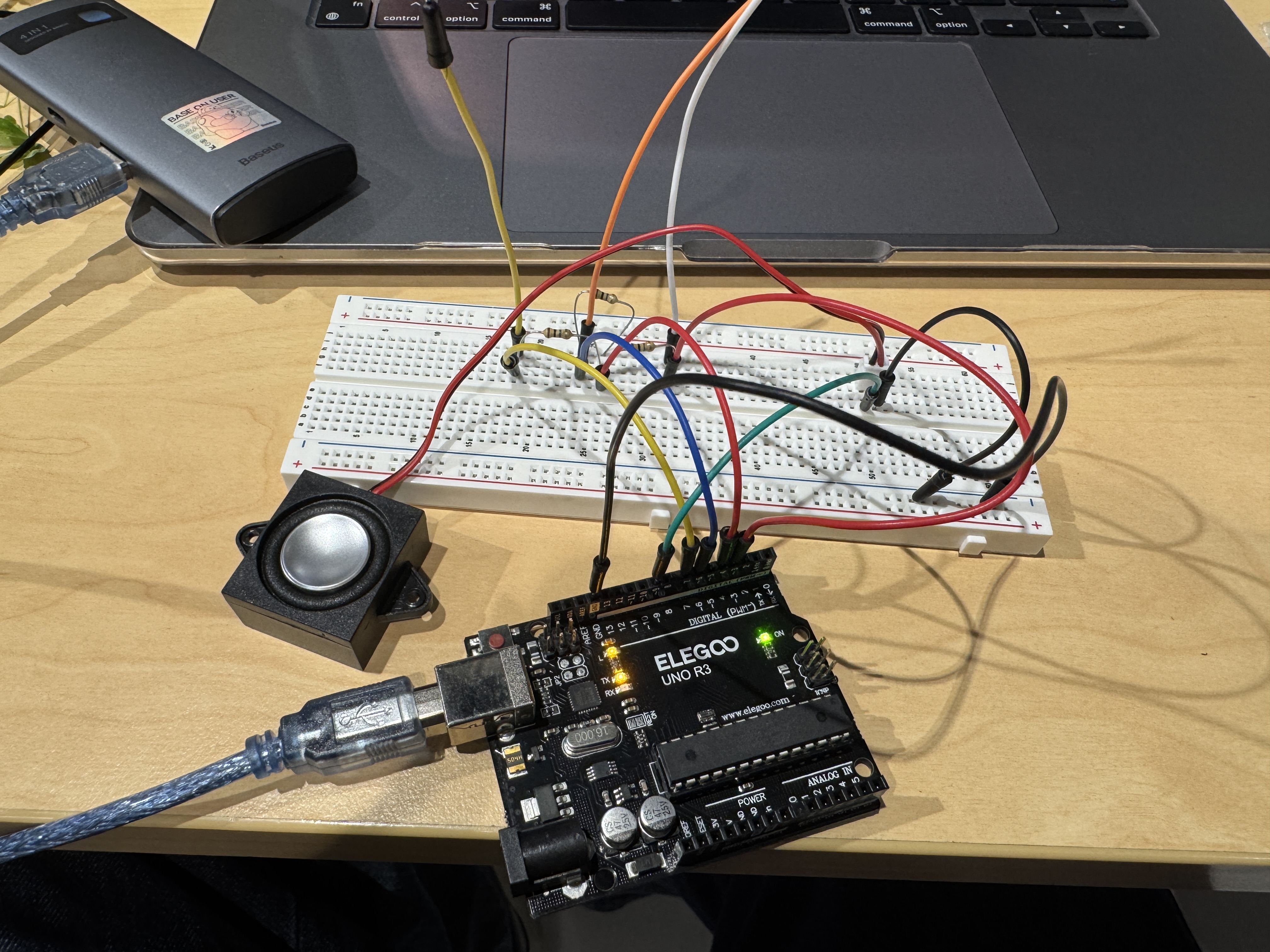 This is the installation we made this week: several wires are connected to the Arduino, each wire corresponding to a different pitch. When your fingers touch them, they will produce the sounds of do, re, mi, like a mini electronic piano.